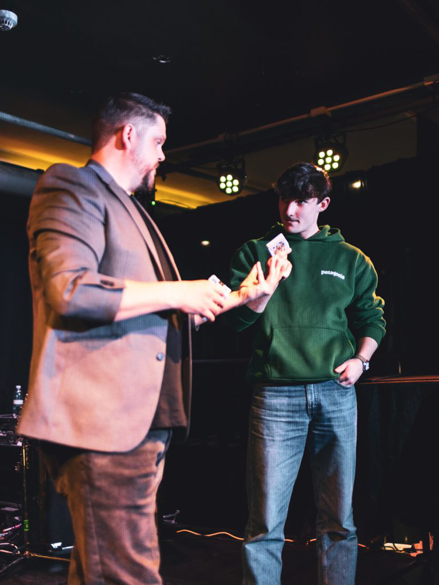 Mark Roberts performing magic and mind-reading on stage